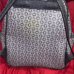 Barely used Guess bag. Used about 4 times. No tips , No tears.